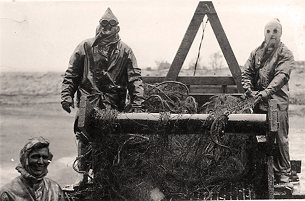 The nets were tarred to make them more durable. This was difficult work done while wearing hot and uncomfortable protective clothing.