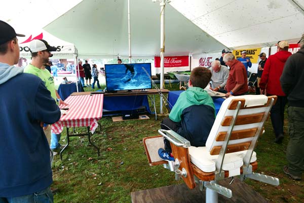 Young angler faces off against an airborne marlin