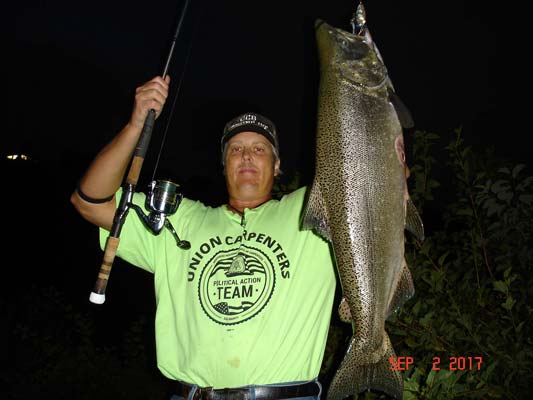 Mike Rzucidlo of Niagara Falls with his first king in the Niagara River this year.