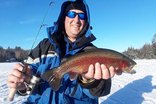 David Nava of Charlestown Mass took this nice trout on a PK Minnow from a lake near the White Mountains.