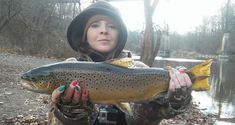 Buffy Frank with colorful brown trout from the Burt dam area.