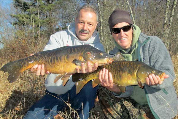 two friends with a couple of mirror carp