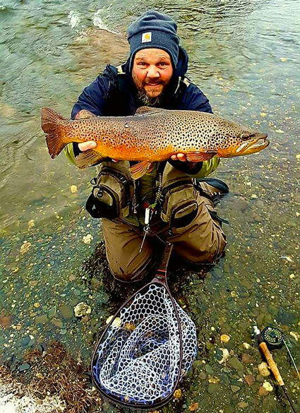 Brandon Zeoli of Hillsborough with his catch of a brown trout. 