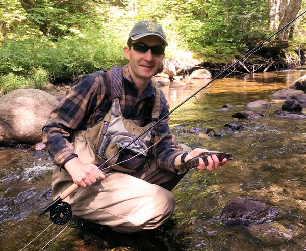 The author samples the brook trout population with a fly rod.