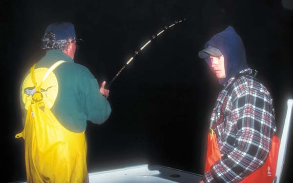 Captain Cal Robinson with a good fish on a jig