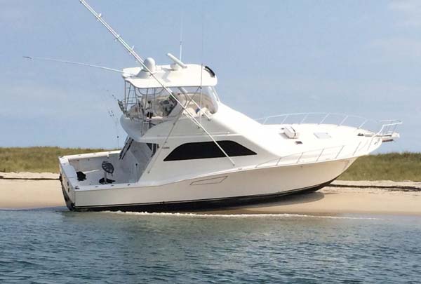 This well-equipped boat ran aground in a tight channel in the fog.