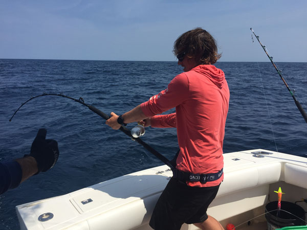 Connor White fights a stout 47-inch yellowfin