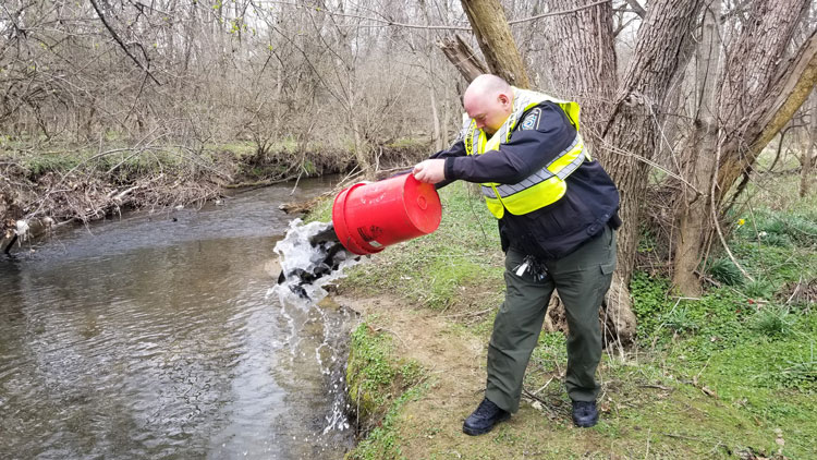 Deputy Yerter stocking trout