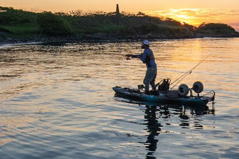kayak angler at sunset