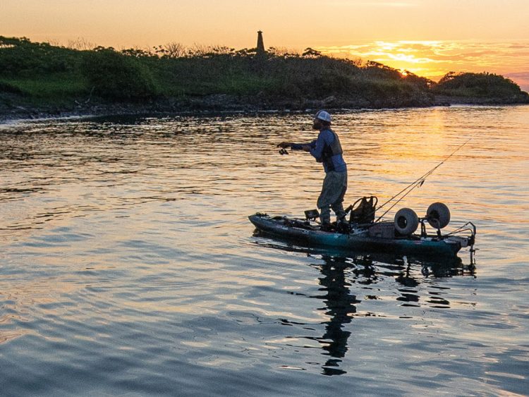 kayak angler at sunset