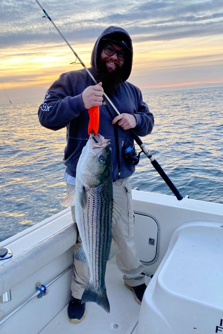 Corey Vafiadis with one of the many stripers he caught off Long Branch last Friday.