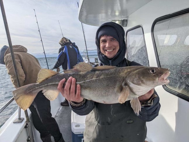 Dan Pendergraph holding a cod that was caught at Coxes Ledge.