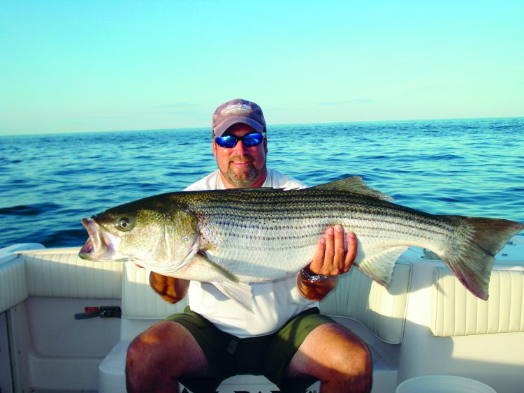 Captain Stu Patterson located bunker schools in open Long Island Sound and found his personal best striper hounding those baitfish.