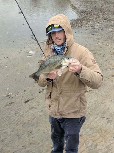 Tim Regan holding a white perch.