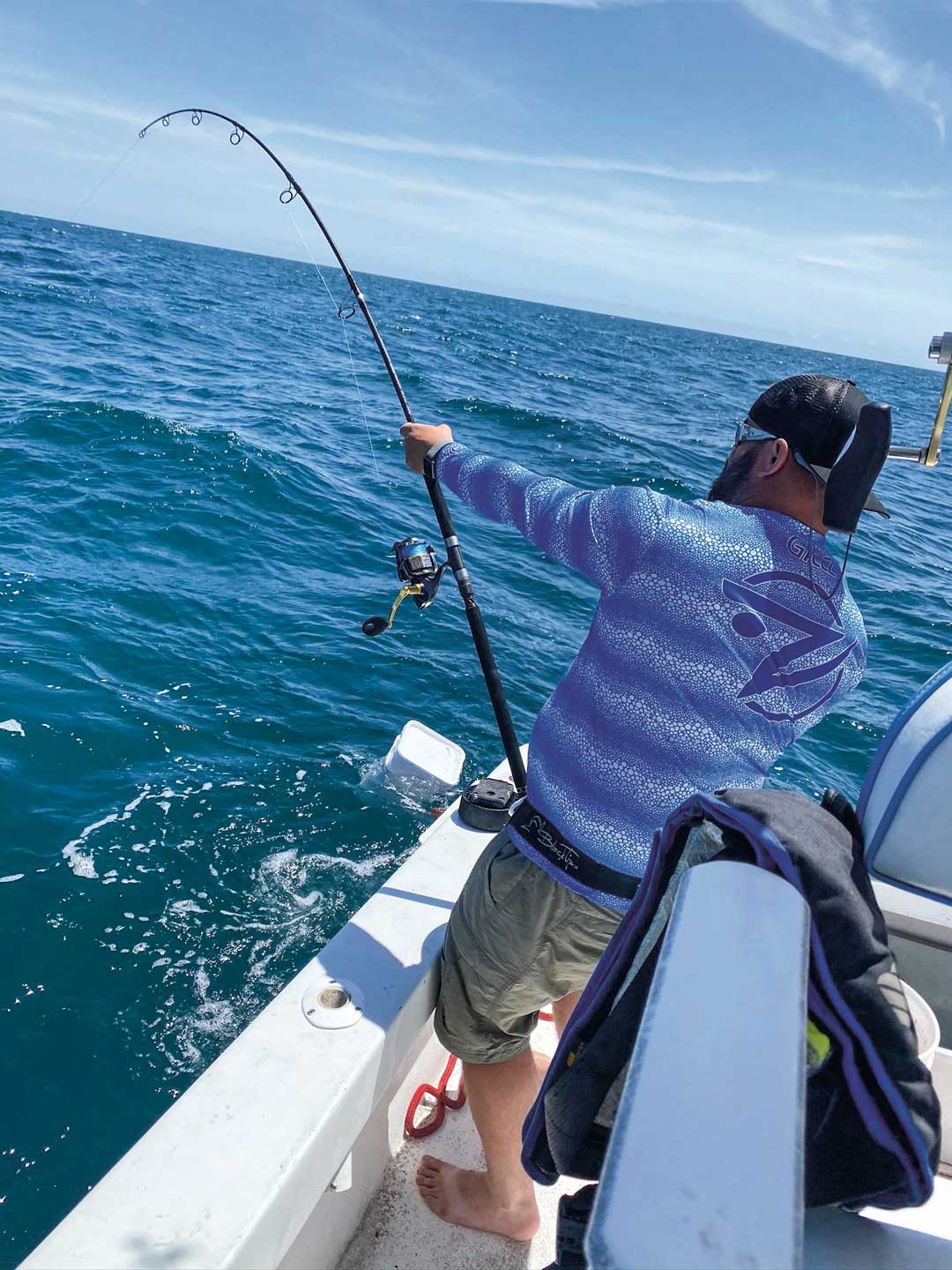 angler fighting shark