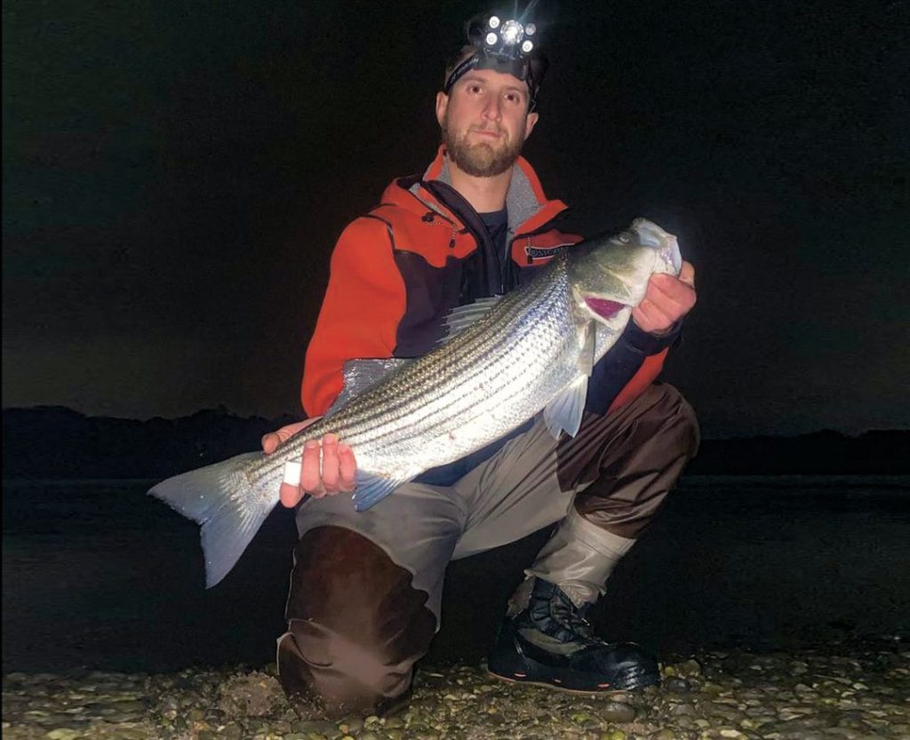 Sean Conway with striped bass