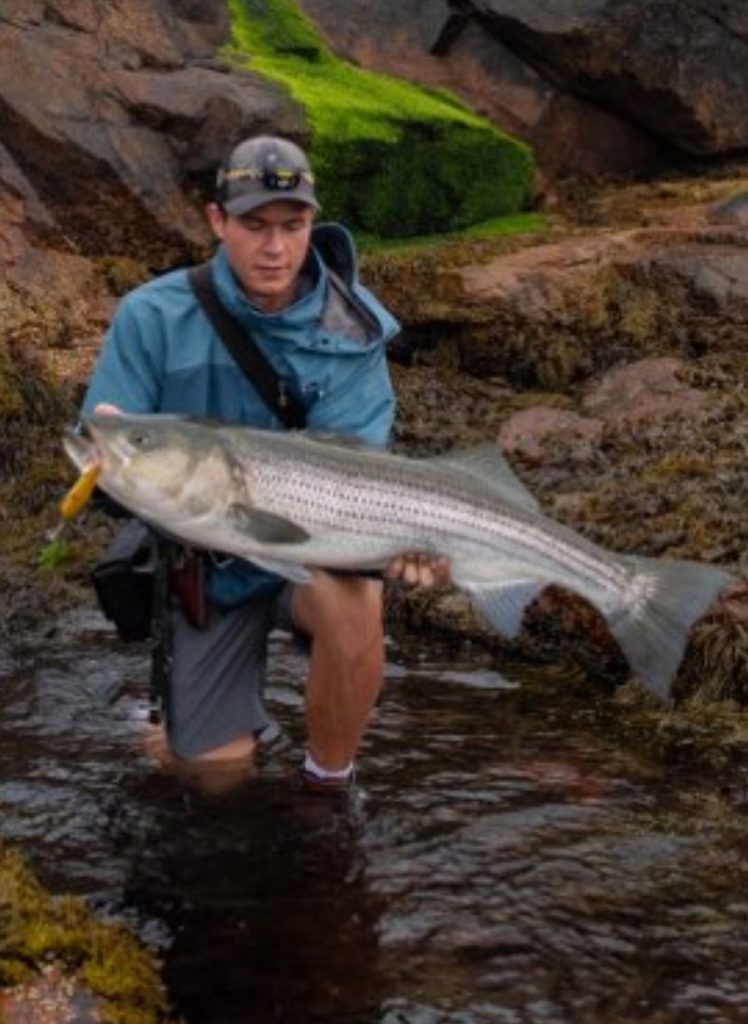 Finn Hawley with striped bass