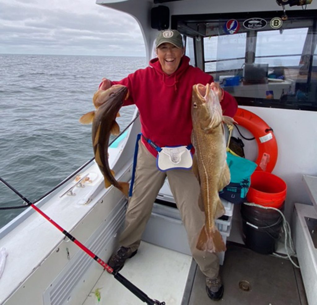 Judith Collins with pair of cod