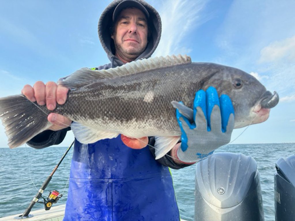 John with fluke aboard the Little Sister