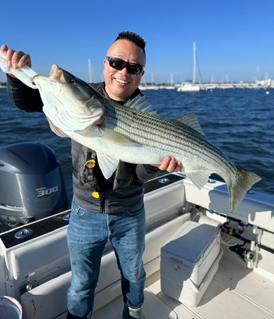 Tomo from Tomo&rsquo;s Tackle with striped bass