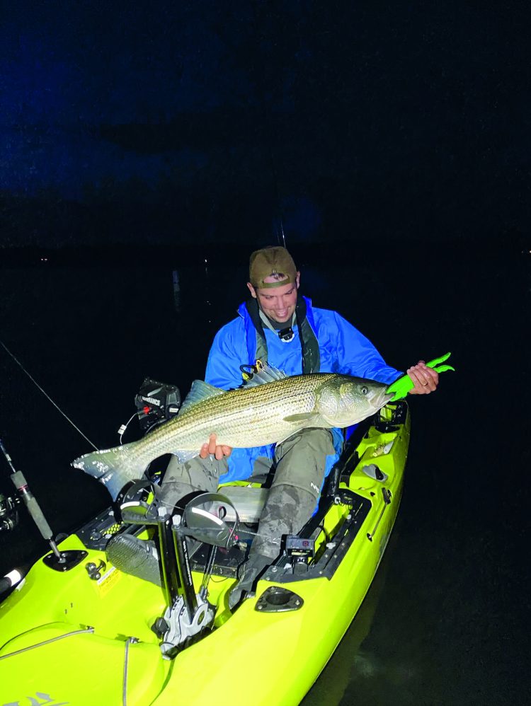kayak fishing for stripers at night