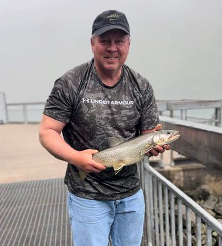 Tommy Holycross with lake trout
