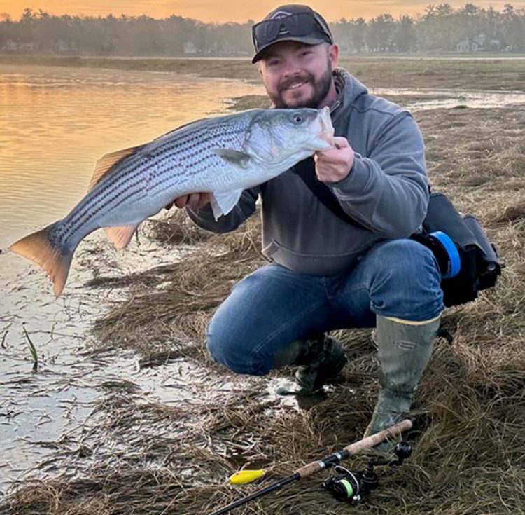 Riley Libby with striped bass