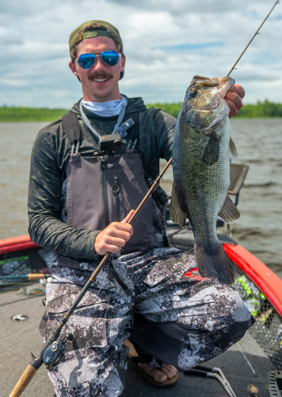 Jonathan Barzacchini with tagged largemouth bass