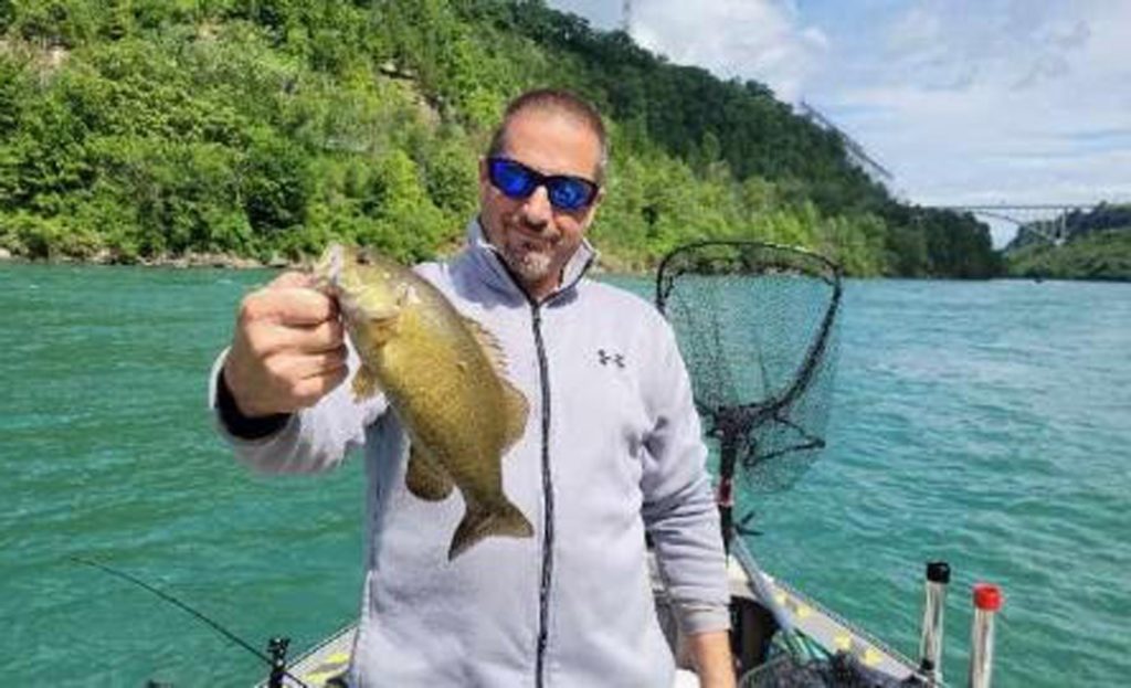 Capt. Dave Scipione with smallmouth bass