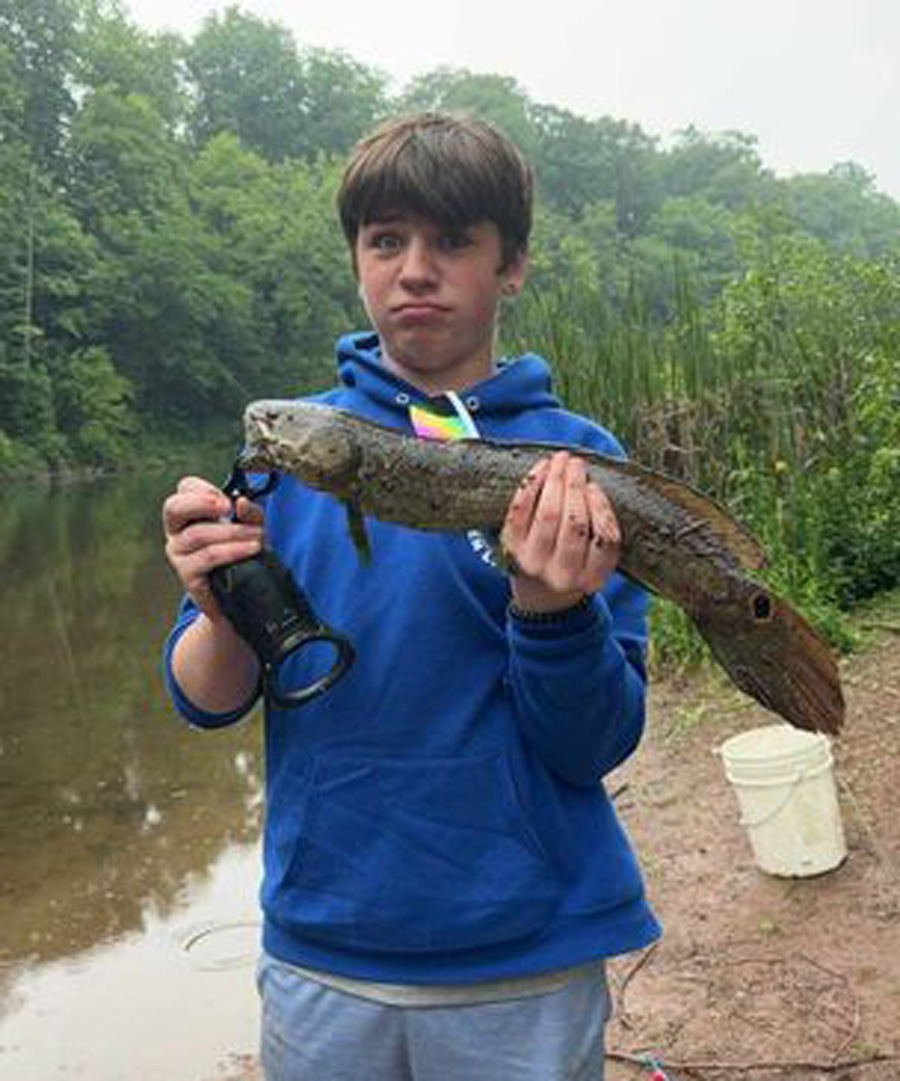 Noah Habalou with bowfin
