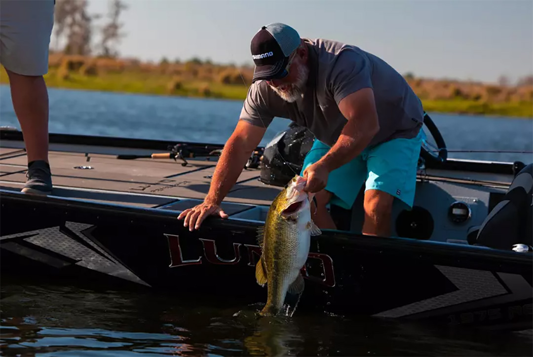bass angler with big largemouth