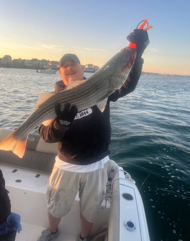 Mike Pizzuto with striped bass