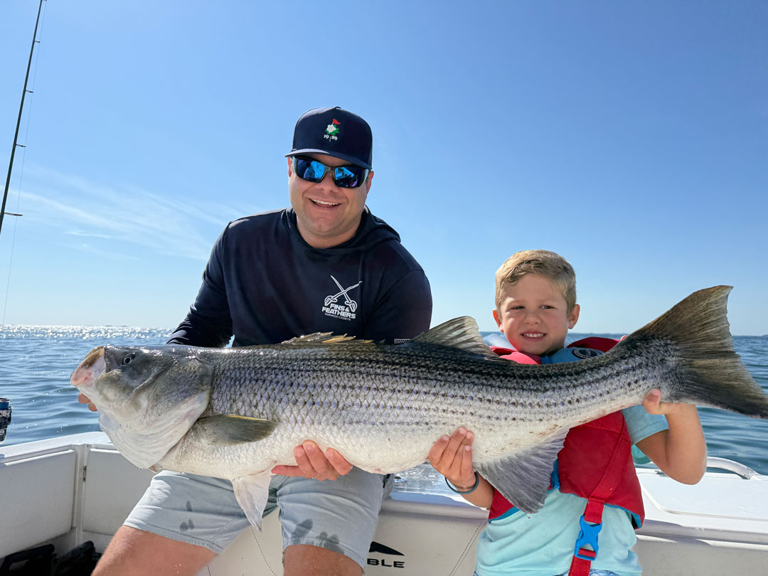 6 Yr old Matthew McShane with striped bass