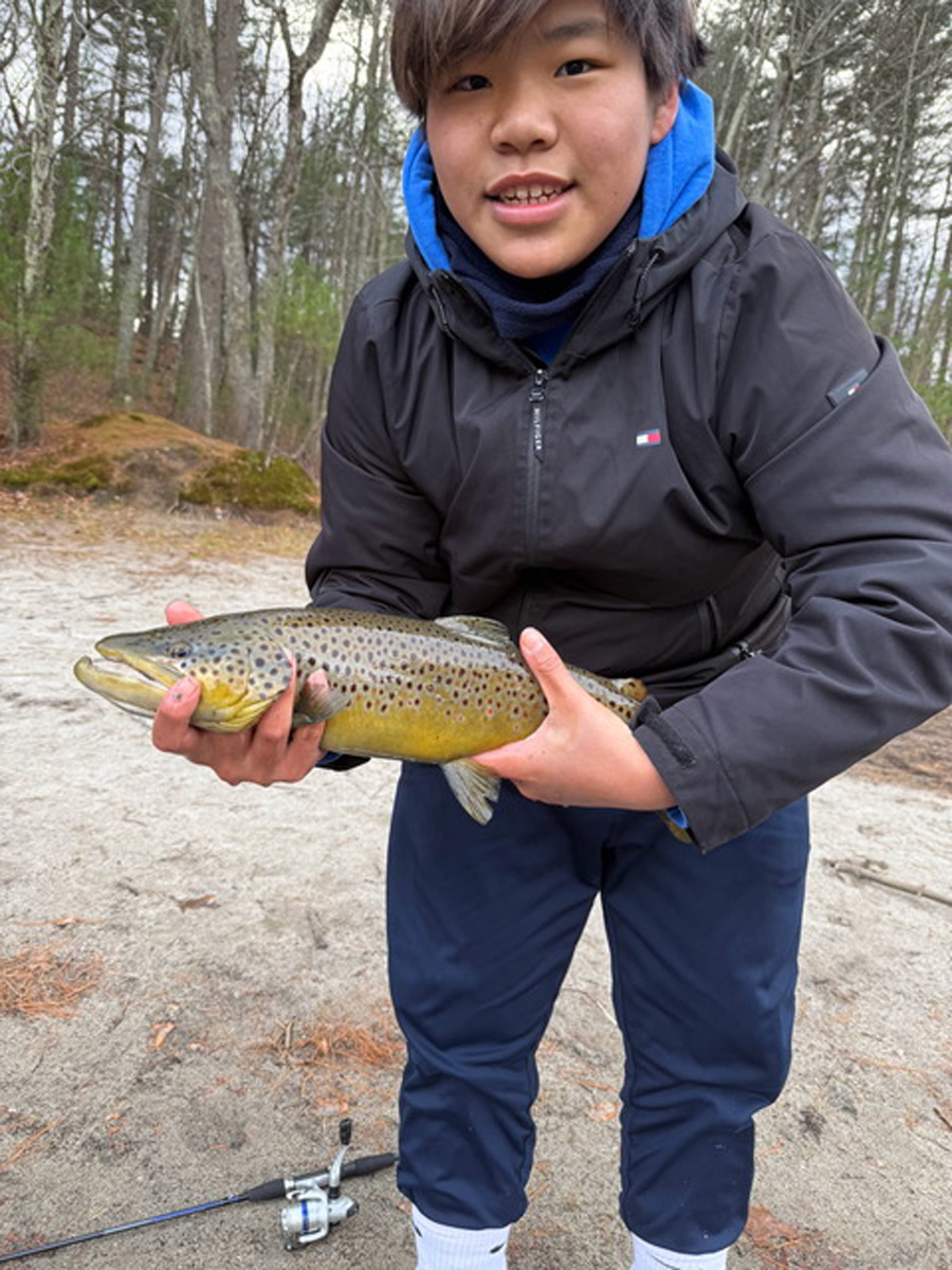 Brendan Xie with brown trout