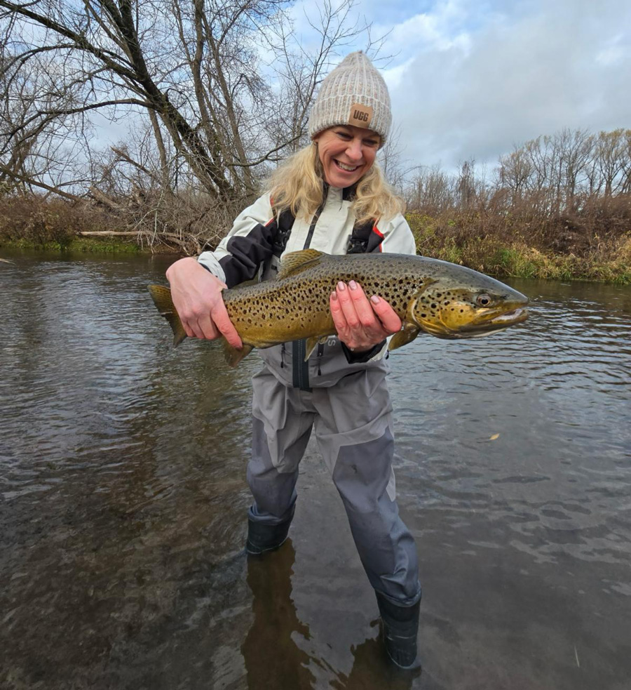 Heather B. with her first fish on a fly rod!