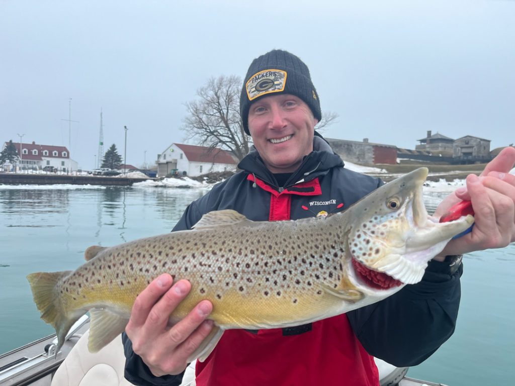 Justin Bauman with brown trout 