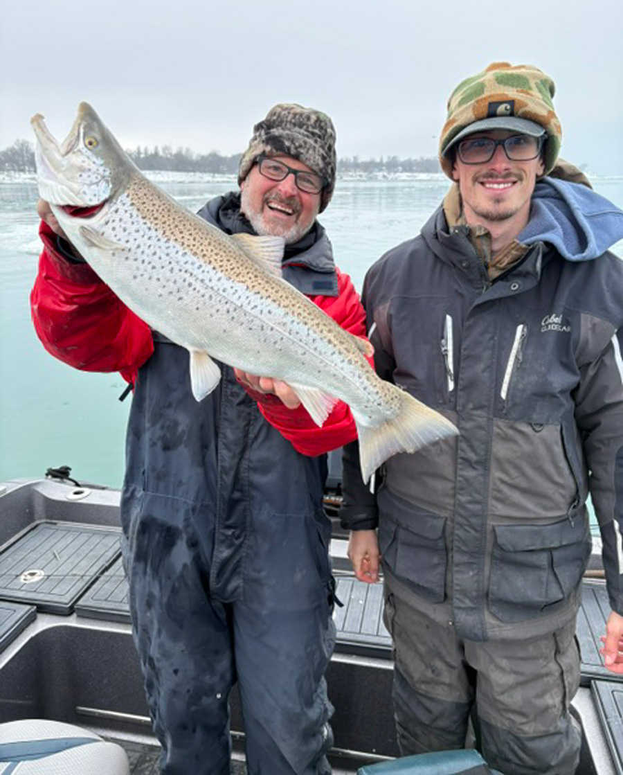Capt. Joe Cinelli nephew, Capt. Connor Cinelli with brown trout