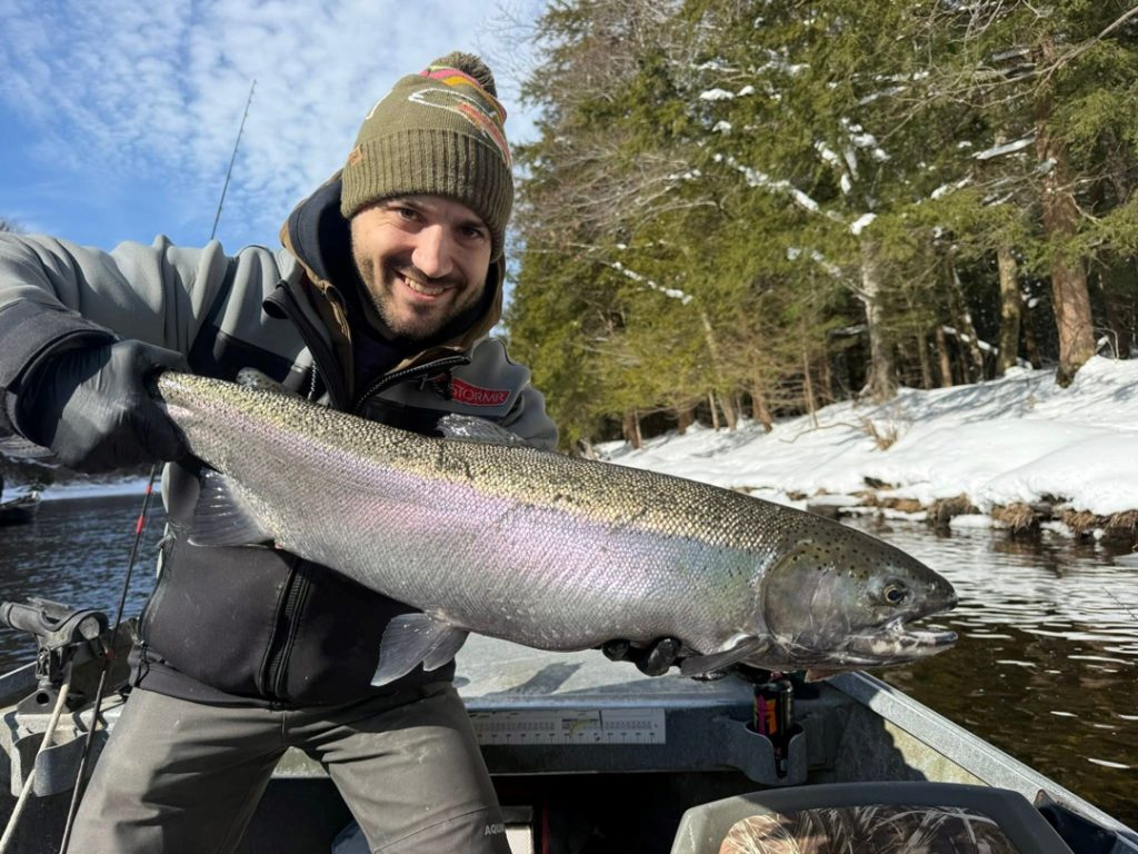 Tommy Q. with a bright steelhead