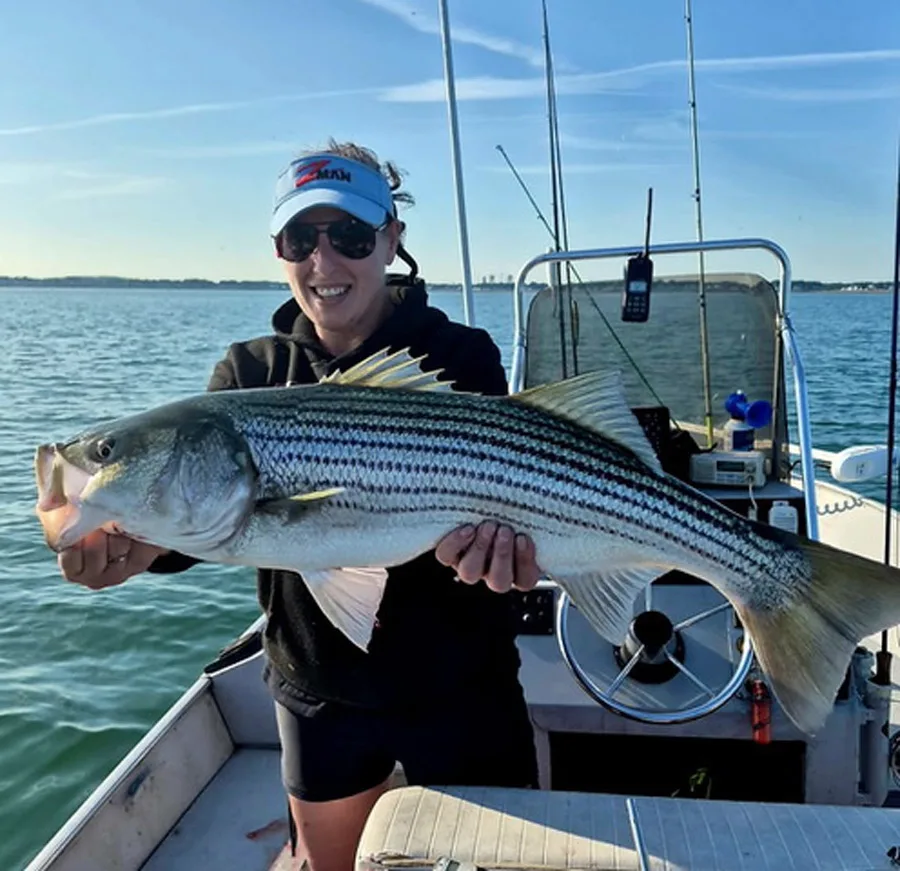 Megan Cuzzupe with striped bass